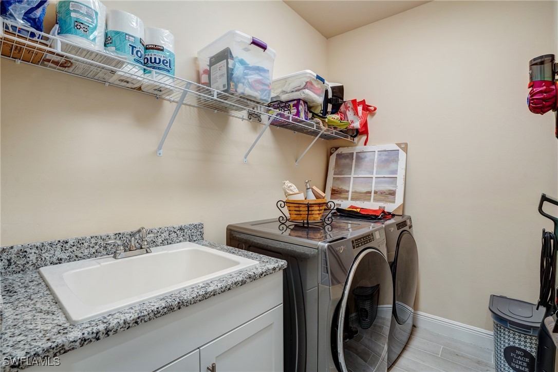 9292 Cayman Drive Naples, FL 34114 - Photo 25 of 50 a utility room with dryer and washer