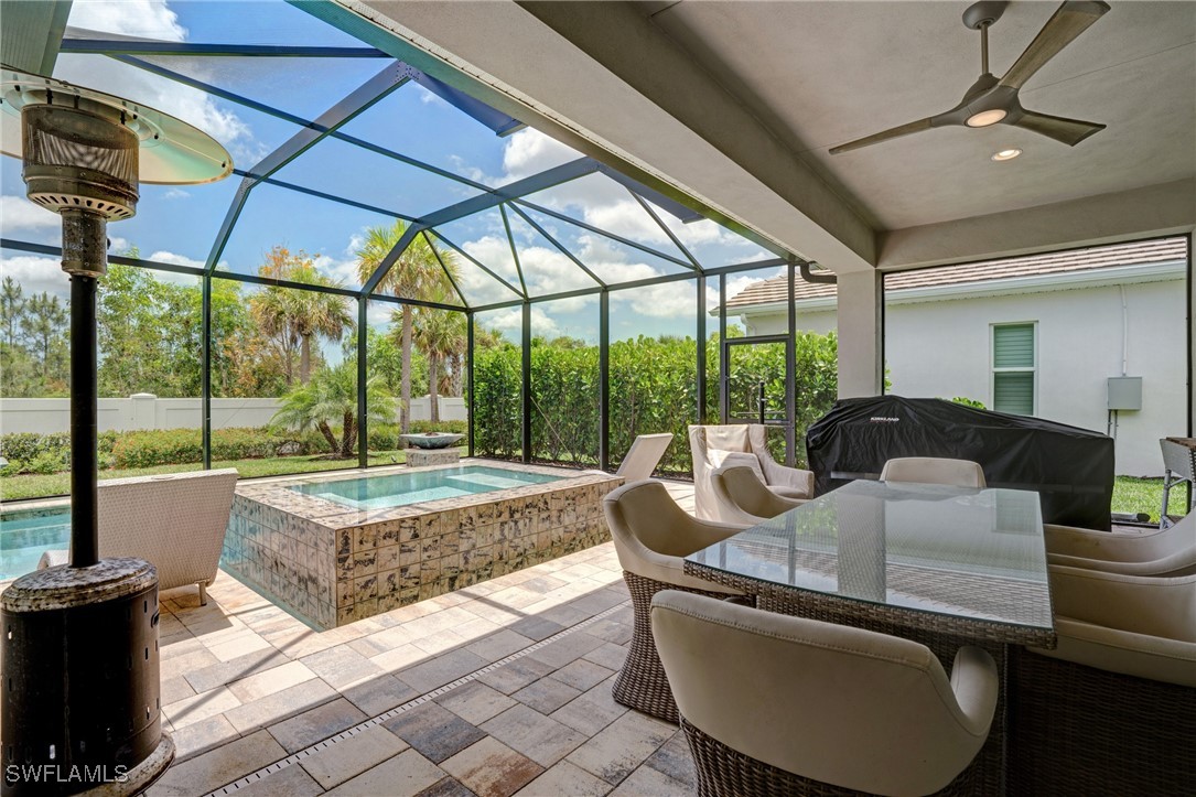 9292 Cayman Drive Naples, FL 34114 - Photo 28 of 50 a balcony with furniture and large windows