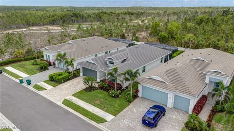 a kitchen with kitchen island granite countertop a sink cabinets and stainless steel appliances