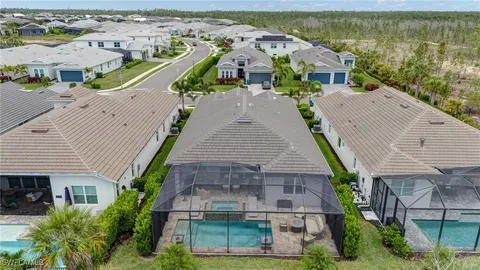 an aerial view of a house with a lake view