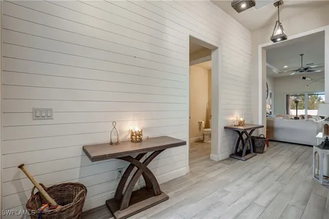 an aerial view of a house with a yard and potted plants