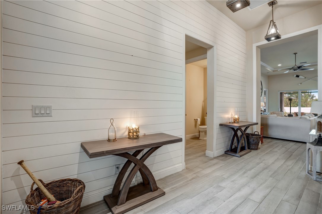 9292 Cayman Drive Naples, FL 34114 - Photo 36 of 50 a workspace with wooden floor