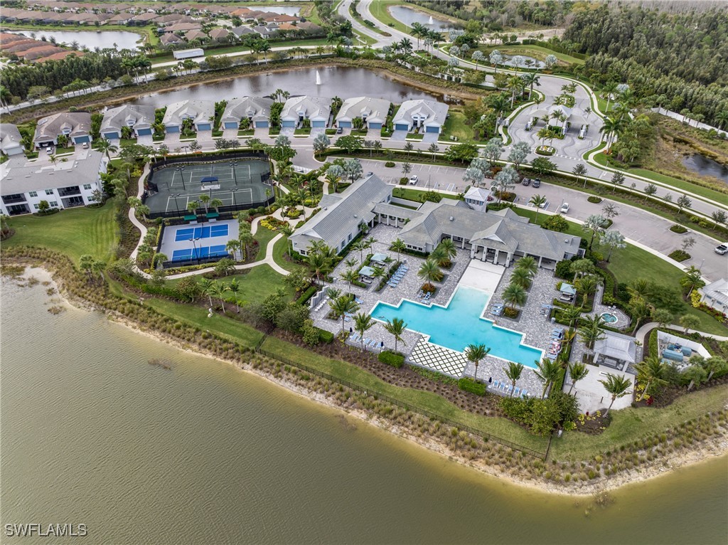 9292 Cayman Drive Naples, FL 34114 - Photo 38 of 50 an aerial view of a house with a lake view