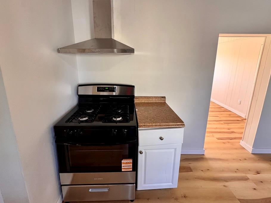 1332 Goettmann Street, Unit 3 Pittsburgh, PA 15212 - Photo 13 of 24 a kitchen with a stove and a microwave