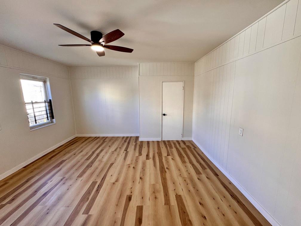 1332 Goettmann Street, Unit 3 Pittsburgh, PA 15212 - Photo 17 of 24 an empty room with wooden floor closet and windows