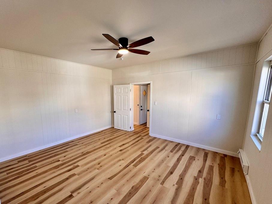 1332 Goettmann Street, Unit 3 Pittsburgh, PA 15212 - Photo 18 of 24 a view of empty room with wooden floor and fan