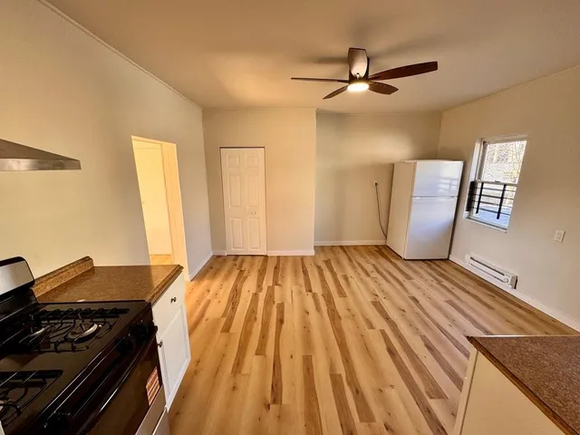 a view of a livingroom with wooden floor