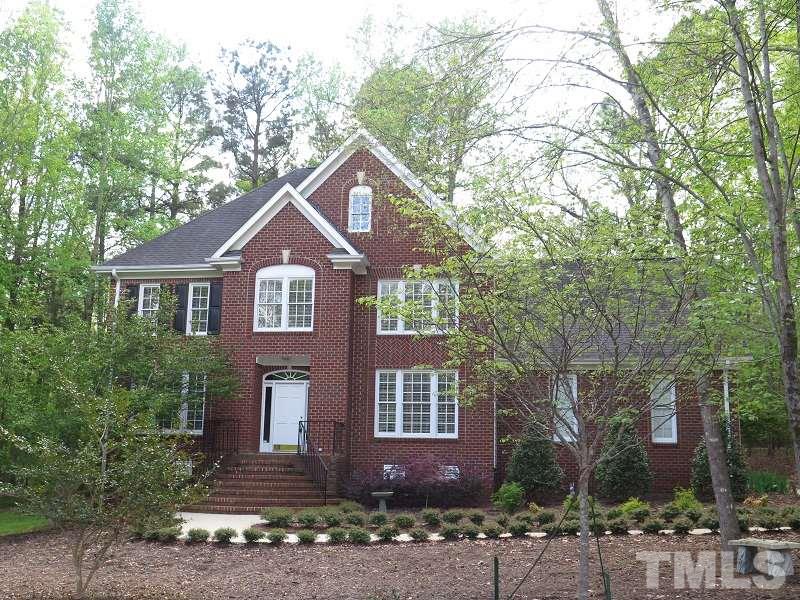809 Nolstead Court Raleigh, NC 27614 - Photo 1 of 23 a front view of a house with a garden