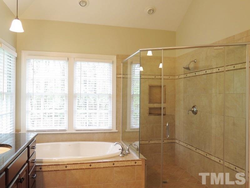 809 Nolstead Court Raleigh, NC 27614 - Photo 13 of 23 a bathroom with a bathtub and shower