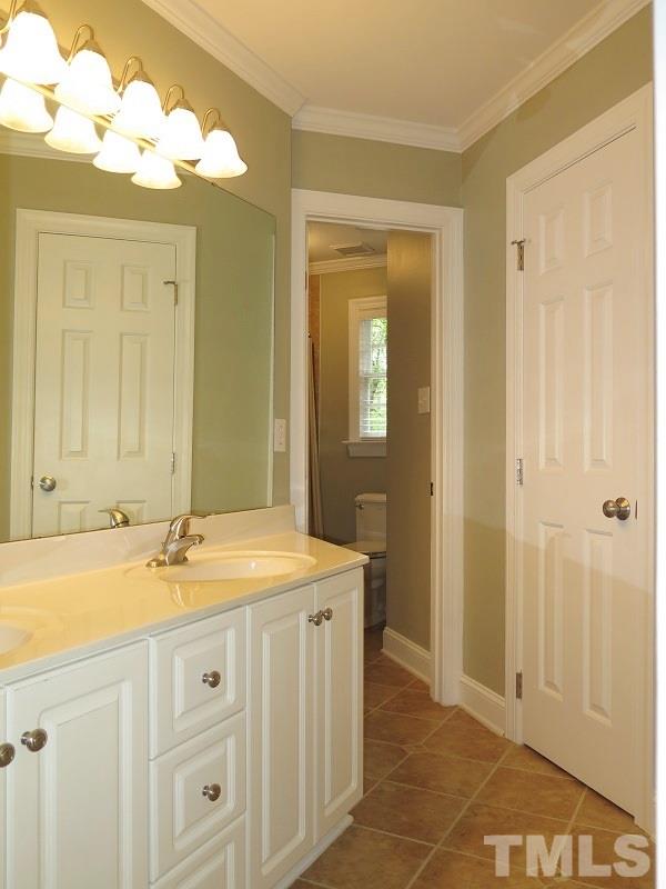 809 Nolstead Court Raleigh, NC 27614 - Photo 16 of 23 a bathroom with a sink vanity granite and a mirror