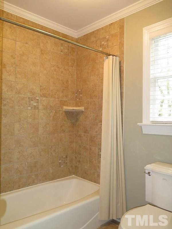 809 Nolstead Court Raleigh, NC 27614 - Photo 17 of 23 a bathroom with a shower and a toilet