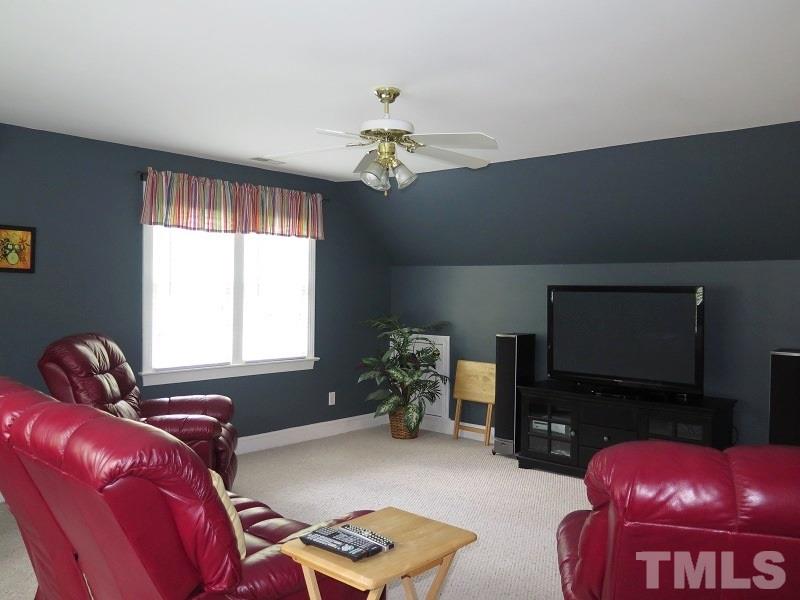 809 Nolstead Court Raleigh, NC 27614 - Photo 19 of 23 a bedroom with furniture and a window