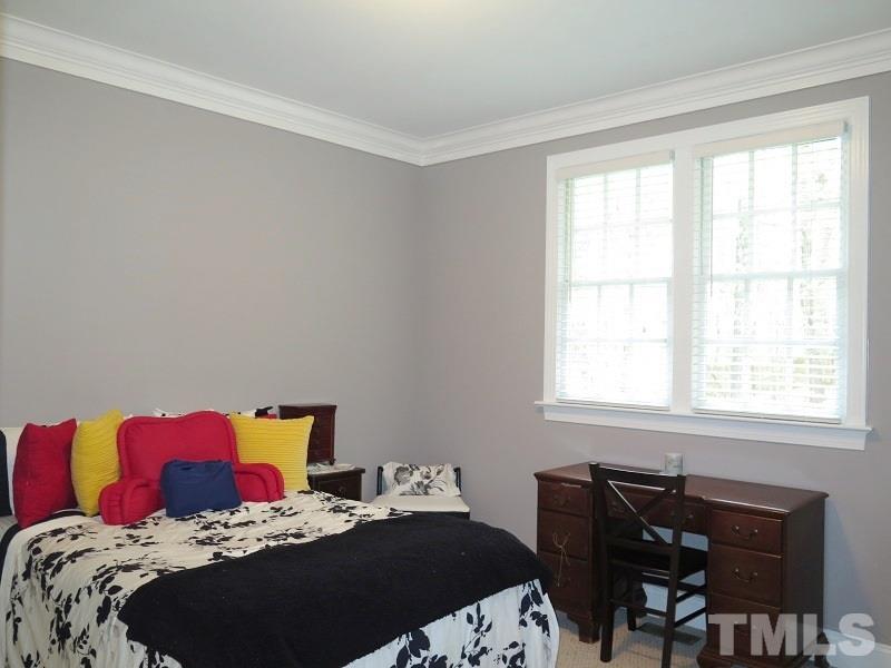 809 Nolstead Court Raleigh, NC 27614 - Photo 20 of 23 a bedroom with a bed and a window
