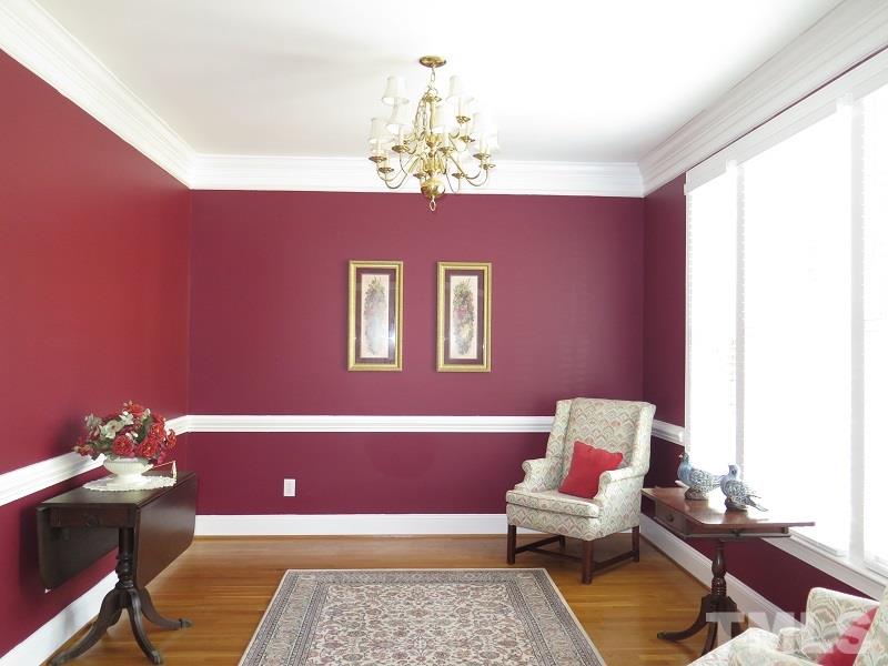 809 Nolstead Court Raleigh, NC 27614 - Photo 3 of 23 a living room with furniture chandelier and a window