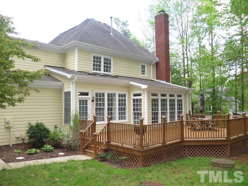 809 Nolstead Court Raleigh, NC 27614 - Photo 22 of 23 a view of a house with a yard and a garden
