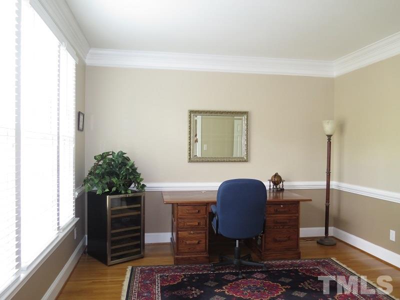 809 Nolstead Court Raleigh, NC 27614 - Photo 4 of 23 a view of workspace filled with furniture and wooden floor