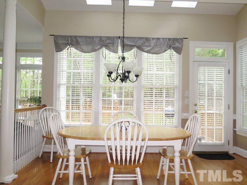 809 Nolstead Court Raleigh, NC 27614 - Photo 9 of 23 a view of a dining room with furniture window and outside view
