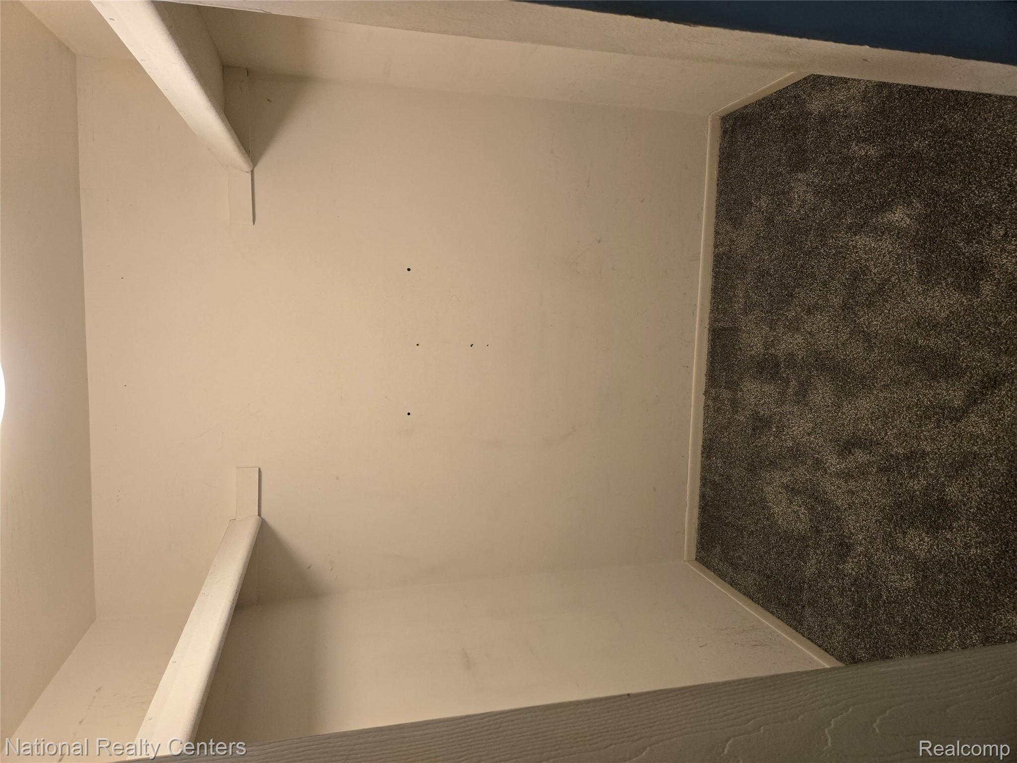 27354 Evergreen Road Southfield, MI 48076 - Photo 3 of 13 Walk in closet featuring dark carpet