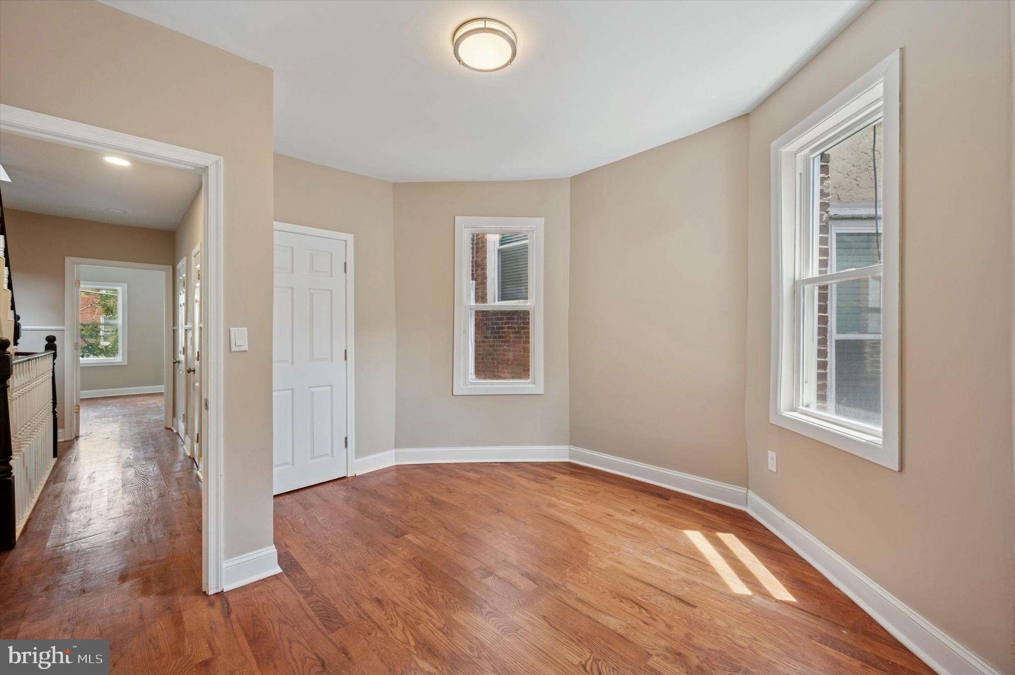 6212 Callowhill Street Philadelphia, PA 19151 - Photo 18 of 23 wooden floor in an empty room with a window
