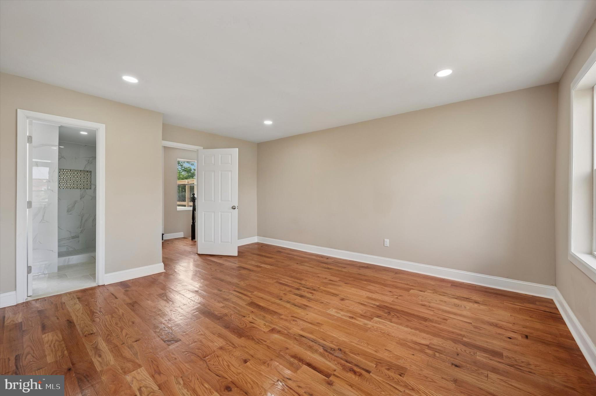 6212 Callowhill Street Philadelphia, PA 19151 - Photo 22 of 23 a view of an empty room with wooden floor and closet