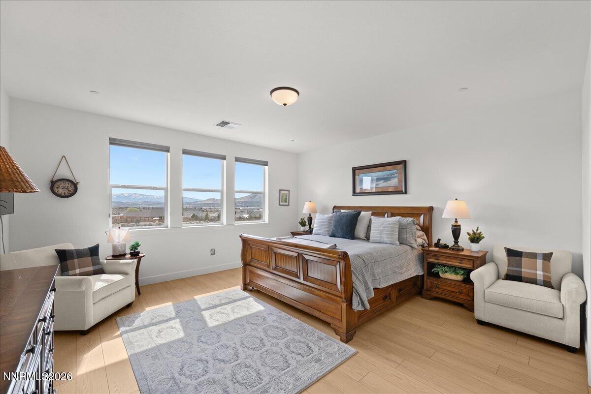 348 South Pah Rah Rdg Drive Sparks, NV 89441 - Photo 25 of 45 a spacious bedroom with a bed and a couch