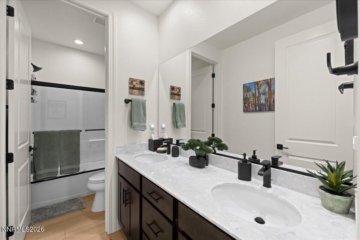 348 South Pah Rah Rdg Drive Sparks, NV 89441 - Photo 30 of 45 a bathroom with a sink double vanity and a shower