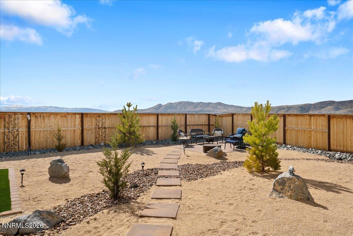 348 South Pah Rah Rdg Drive Sparks, NV 89441 - Photo 40 of 45 a view of a patio with a table and chairs under an umbrella