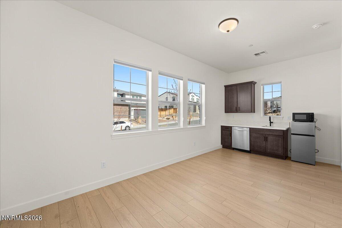 348 South Pah Rah Rdg Drive Sparks, NV 89441 - Photo 8 of 45 a view of a kitchen with a sink cabinet a fireplace and windows