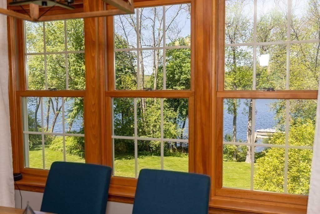 8 Merrimack River Road Groveland, MA 01834 - Photo 11 of 39 a view of a city from a room with furniture