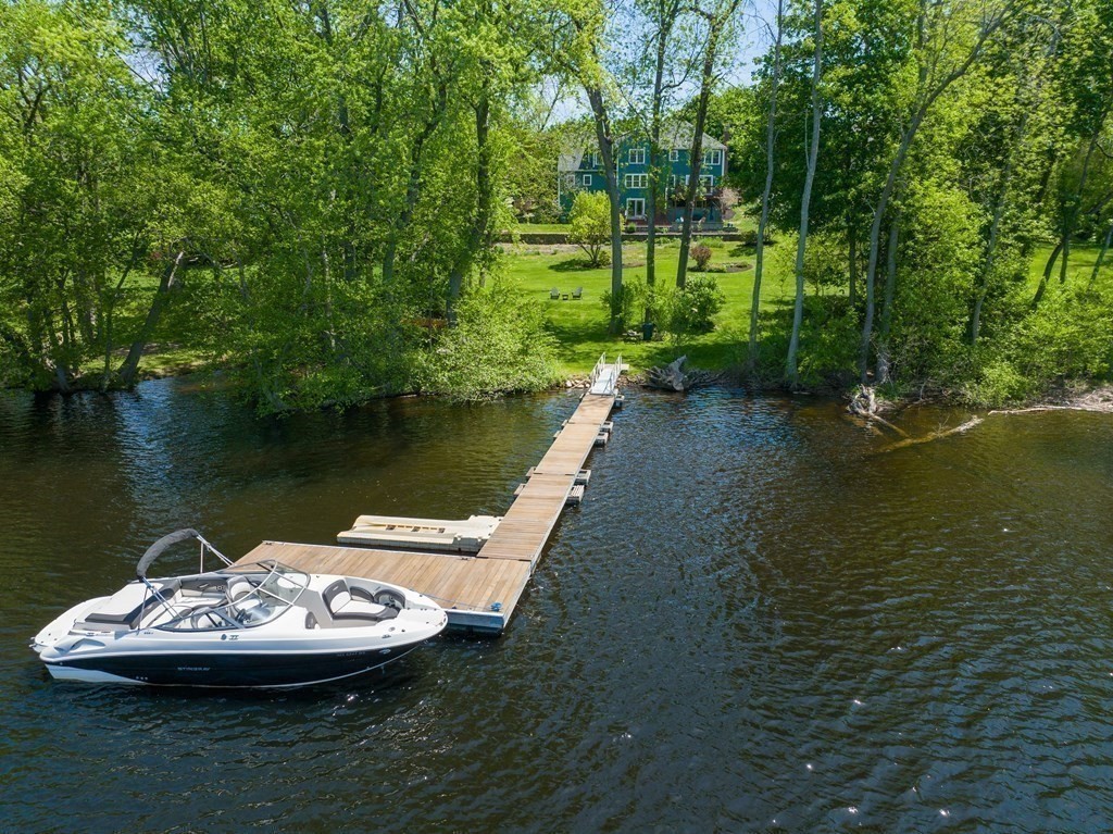 8 Merrimack River Road Groveland, MA 01834 - Photo 2 of 39 a view of a lake with a big yard