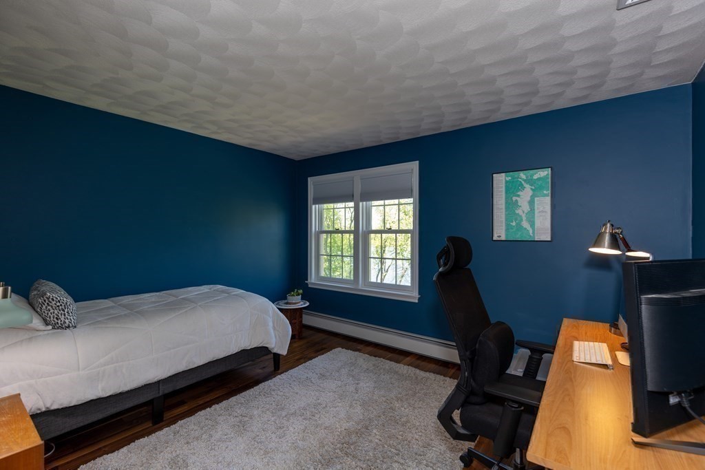 8 Merrimack River Road Groveland, MA 01834 - Photo 24 of 39 a bedroom with a bed a desk and chair