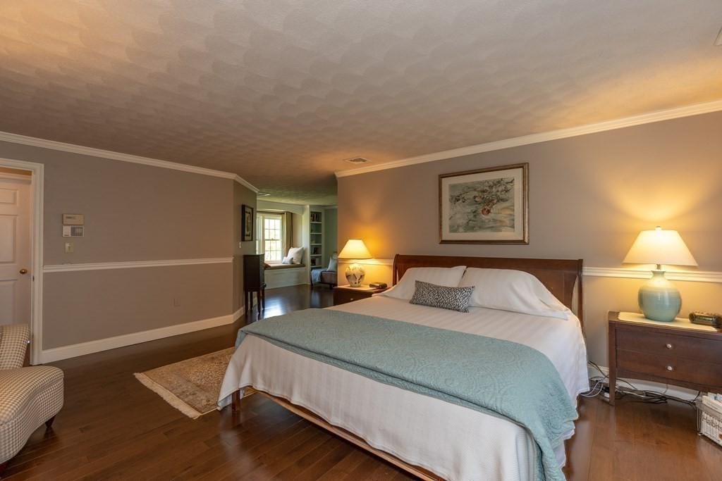 8 Merrimack River Road Groveland, MA 01834 - Photo 27 of 39 a bedroom with a bed and window