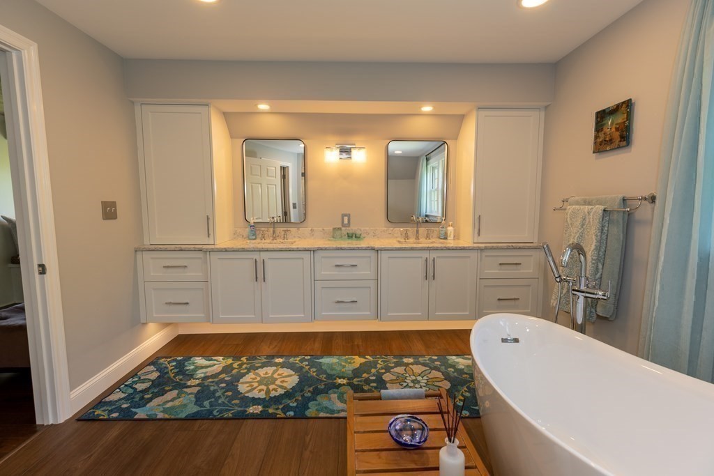 8 Merrimack River Road Groveland, MA 01834 - Photo 30 of 39 a bathroom with a tub a sink and a mirror