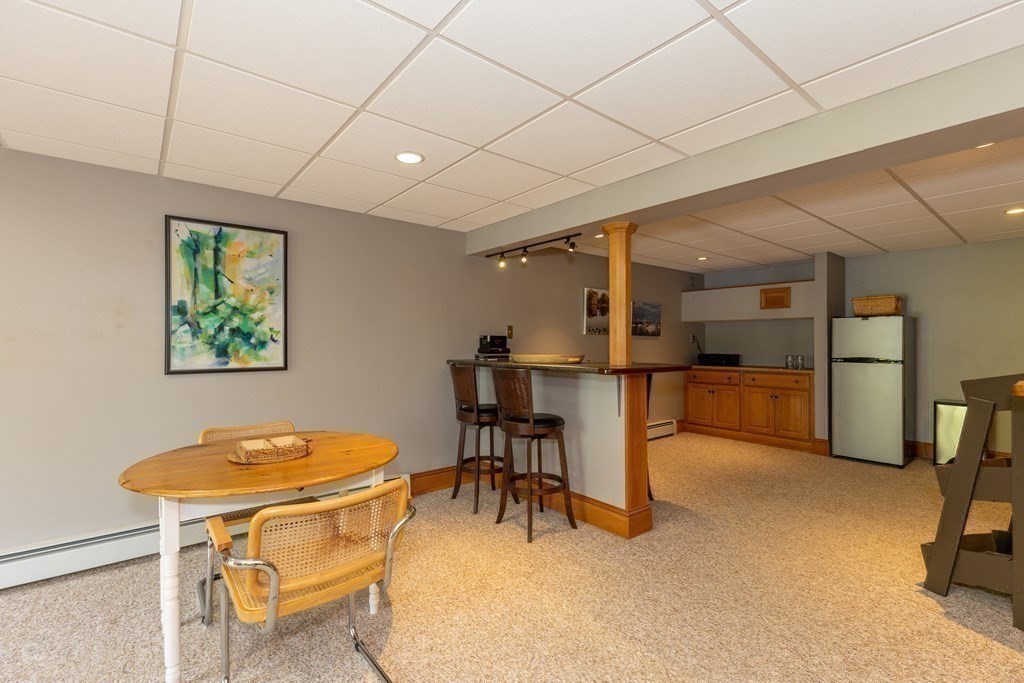 8 Merrimack River Road Groveland, MA 01834 - Photo 34 of 39 a view of a dining room with furniture