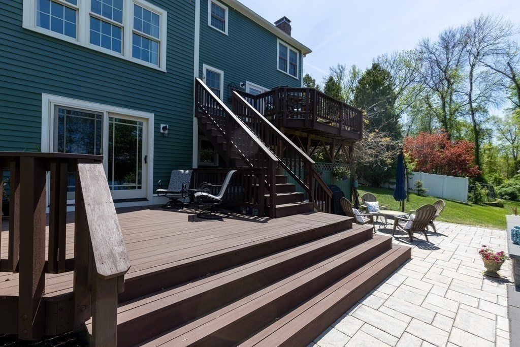 8 Merrimack River Road Groveland, MA 01834 - Photo 35 of 39 a view of a patio with a table chairs and a barbeque