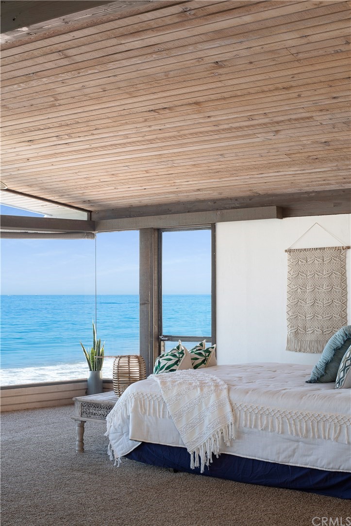 35261 Beach Road Dana Point, CA 92624 - Photo 16 of 34 a living room with a bed furniture and next to a window