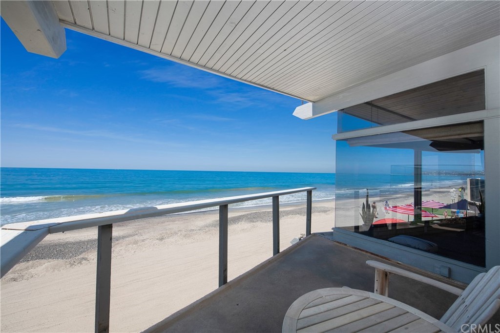 35261 Beach Road Dana Point, CA 92624 - Photo 18 of 34 a kitchen with stainless steel appliances wooden cabinets and a stove top oven
