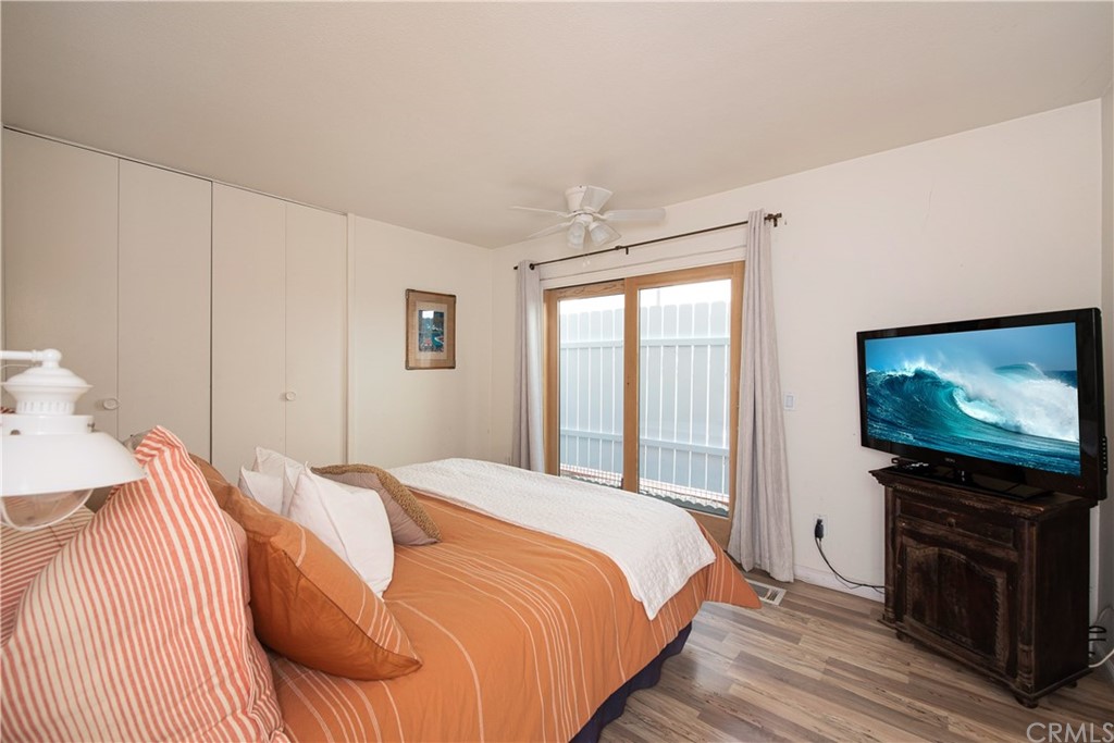 35261 Beach Road Dana Point, CA 92624 - Photo 20 of 34 a bedroom with a bed and a flat screen tv