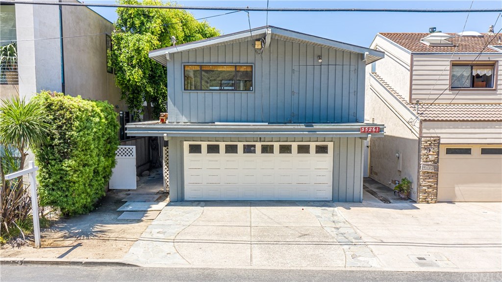 35261 Beach Road Dana Point, CA 92624 - Photo 2 of 34 a front view of house with a garden
