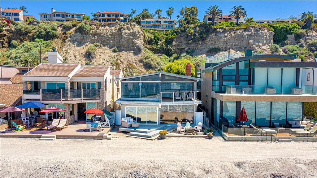 35261 Beach Road Dana Point, CA 92624 - Photo 30 of 34 a view of a brick building with a bench in front of building