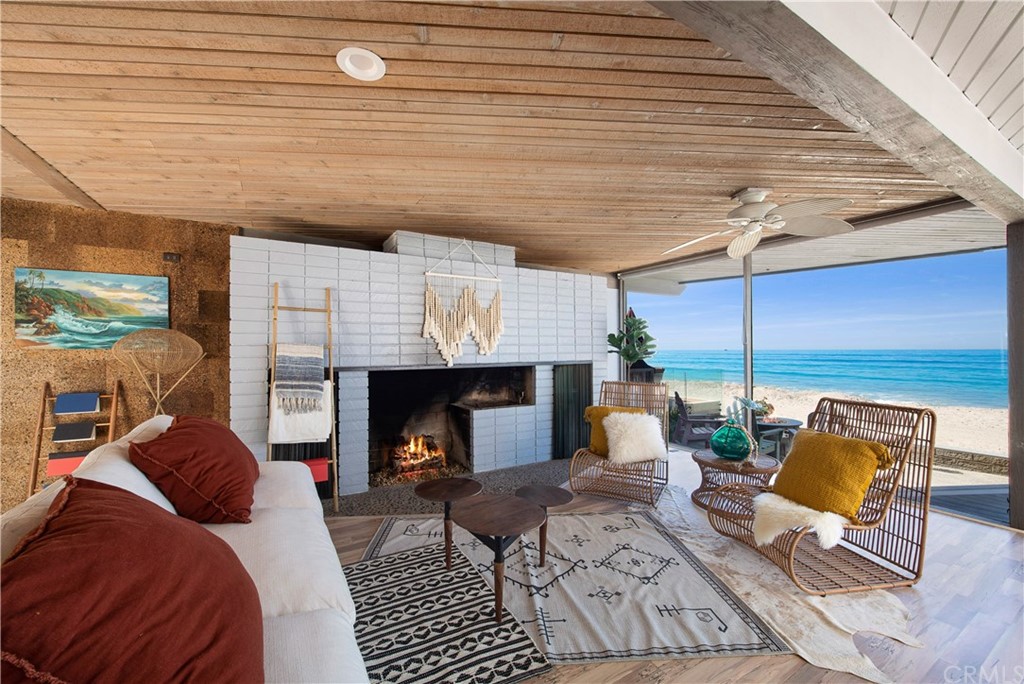 35261 Beach Road Dana Point, CA 92624 - Photo 4 of 34 a living room with furniture and a fireplace