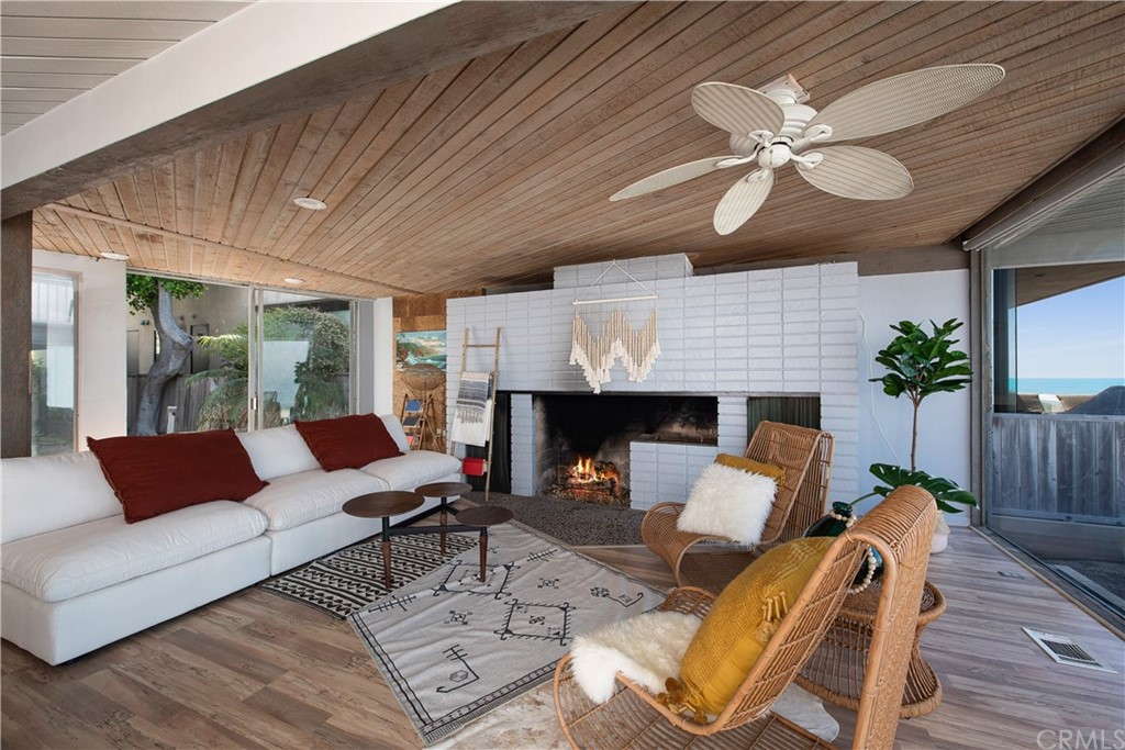 35261 Beach Road Dana Point, CA 92624 - Photo 5 of 34 a living room with furniture and a fireplace