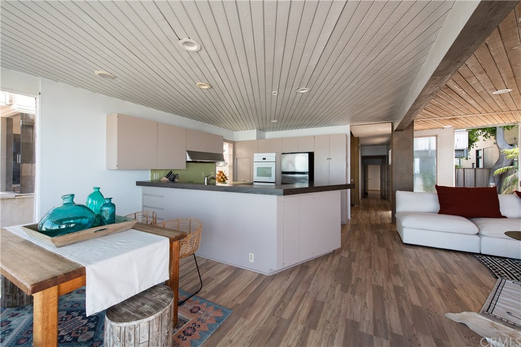 35261 Beach Road Dana Point, CA 92624 - Photo 8 of 34 a living room with furniture and kitchen view
