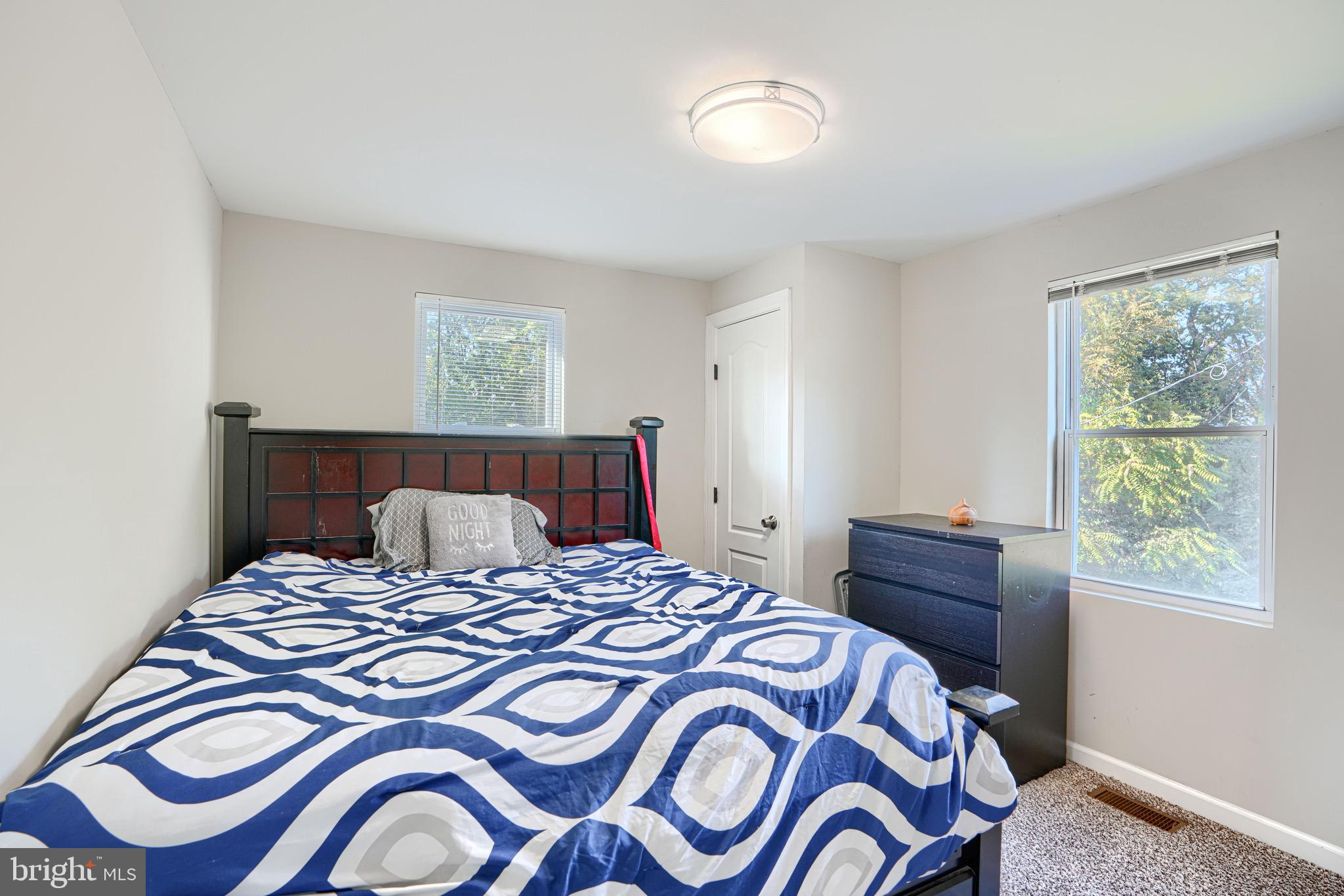 4054 Hilton Road Baltimore, MD 21215 - Photo 14 of 26 a bedroom with a bed and a window