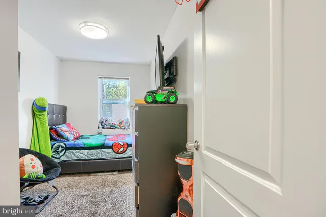 a living room with furniture and flowers