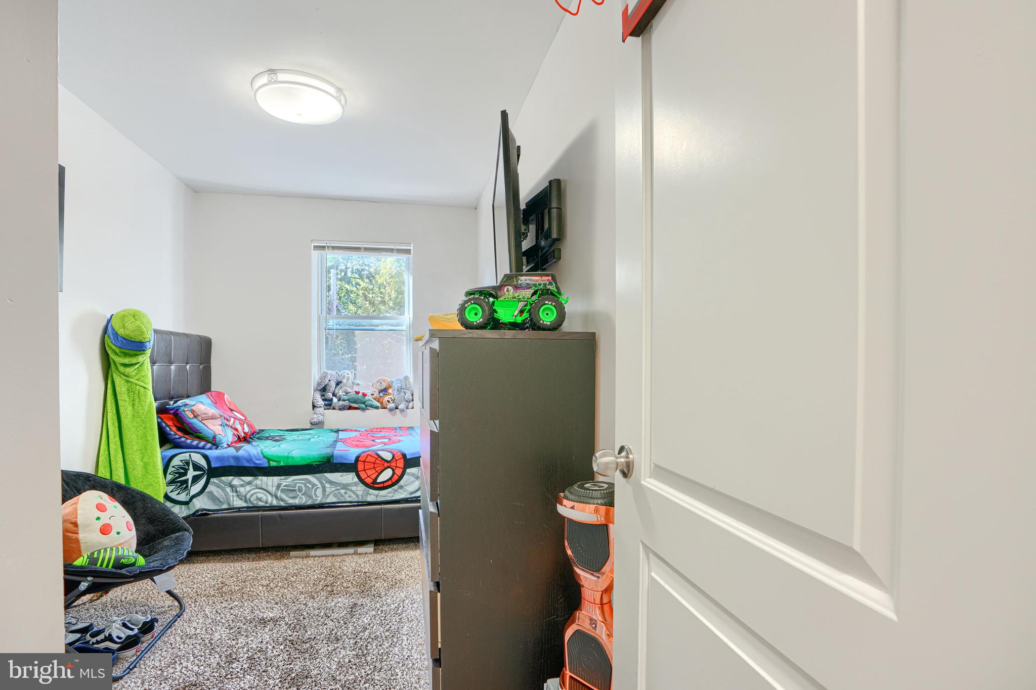 4054 Hilton Road Baltimore, MD 21215 - Photo 16 of 26 a living room with furniture and flowers
