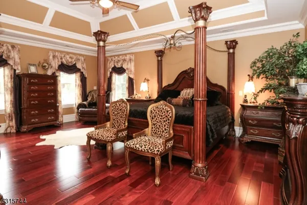 a view of a livingroom with furniture and hardwood floor