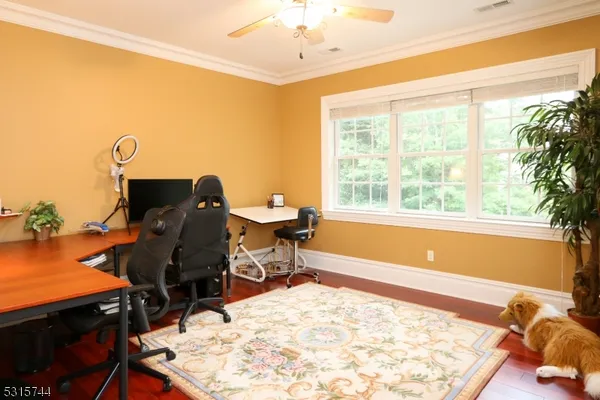 a bed sitting in a room next to a window