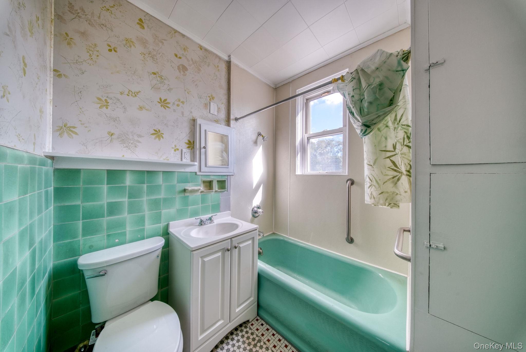 9 Mongaup Road Hurleyville, NY 12747 - Photo 11 of 35 Full bath featuring tub / shower combination, vanity, and tile walls