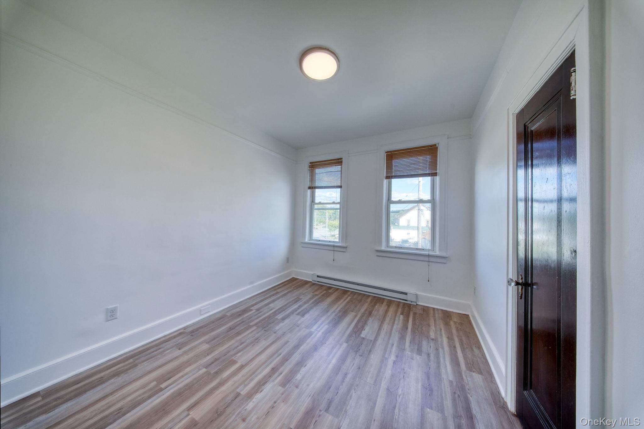 9 Mongaup Road Hurleyville, NY 12747 - Photo 24 of 35 Empty room featuring light wood-style floors and baseboard heating